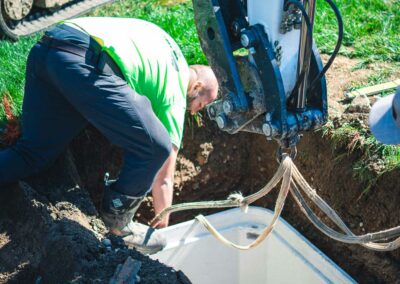 Technician performing septic tank inspection